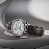 Frederique Constant 37mm Quartz Moonphase Watch FC-206S3S6 styled in a lifestyle setting, reflecting its refined, versatile design suited to both business and evening occasions. The silver-tone dial and leather strap complement a sophisticated, understated look.