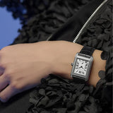 Frederique Constant Classic Quartz Women's 36mm Watch FC-235S2CD6 worn on the wrist, demonstrating the fit of its slim rectangular case and leather strap. The diamond bezel adds sparkle and dimension on the wrist.