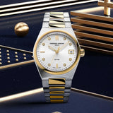 Frederique Constant Highlife Women's 31mm Quartz Watch FC-240VD2NH3B styled in a lifestyle setting, reflecting its versatile design for both everyday and dressier occasions. The two-tone finish and diamond-set dial complement a range of outfits.
