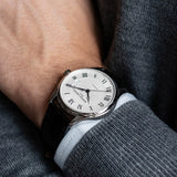 Frederique Constant Classic Automatic Men's 40mm Watch FC-303MC5B6 worn on the wrist, demonstrating the fit of its 40mm case. The rose gold-tone finish sits elegantly for everyday and formal wear.