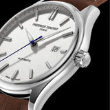 Frederique Constant Classic Automatic Men's 40mm Watch FC-303NS5B6 styled in a lifestyle setting, reflecting its refined, versatile design suited to both business and formal occasions. The silver dial and brown leather strap complement a classic, polished look.
