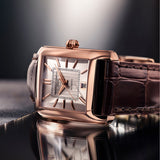 Frederique Constant Classics Carrée Automatic Men's 30mm Watch FC-303V4C4 styled in a lifestyle setting, reflecting its retro 1920s-inspired design suited to smart-casual and formal occasions. The rose gold-tone finish and leather strap complement a refined, vintage-influenced look.
