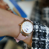 Frederique Constant Highlife Automatic Women's 34mm Watch FC-310VD2NH2B styled in a lifestyle setting, reflecting its versatile design for both everyday and dressier occasions. The two-tone finish and diamond-set dial complement a range of outfits.