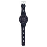 Casio G-Shock GA-2100-1A1 watch front view, featuring a 45.4mm all-black octagonal resin case with Carbon Core Guard construction, clean monochromatic analogue-digital dial with Arabic numeral indices, inverted LCD display, and distinctive integrated band design.