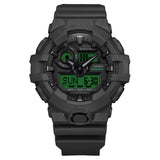 Casio G-Shock GA100BEG-1A front view — all-black round resin case with electro green LCD accents, analogue-digital three-dial layout. 55mm x 51.2mm x 16.9mm, 70 grams, shock resistant, magnetic resistant, 200M water resistant.