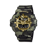 The Casio G-Shock Analogue Digital Watch GA700CMG-3A features a 57.5mm round resin case with four-colour green camouflage MAP-printed bezel, gold vapour deposition dial and sculpted hands, front LED button at 6 o'clock, and matching camouflage resin band.