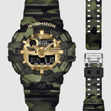 From this angle, the Casio G-Shock GA700CMG-3A reveals the depth of the camouflage MAP-printed bezel, the gold vapour deposition dial shimmer, and the signature front button at 6 o'clock together.