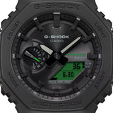 Casio G-Shock GAB2100BEG-1A front view — all-black octagonal Carbon Core Guard bio-based resin case, electro green LCD accents, analogue-digital dual-layer dial. 48.5mm x 45.4mm x 11.9mm, 52 grams, Tough Solar, Bluetooth, 200M water resistant.