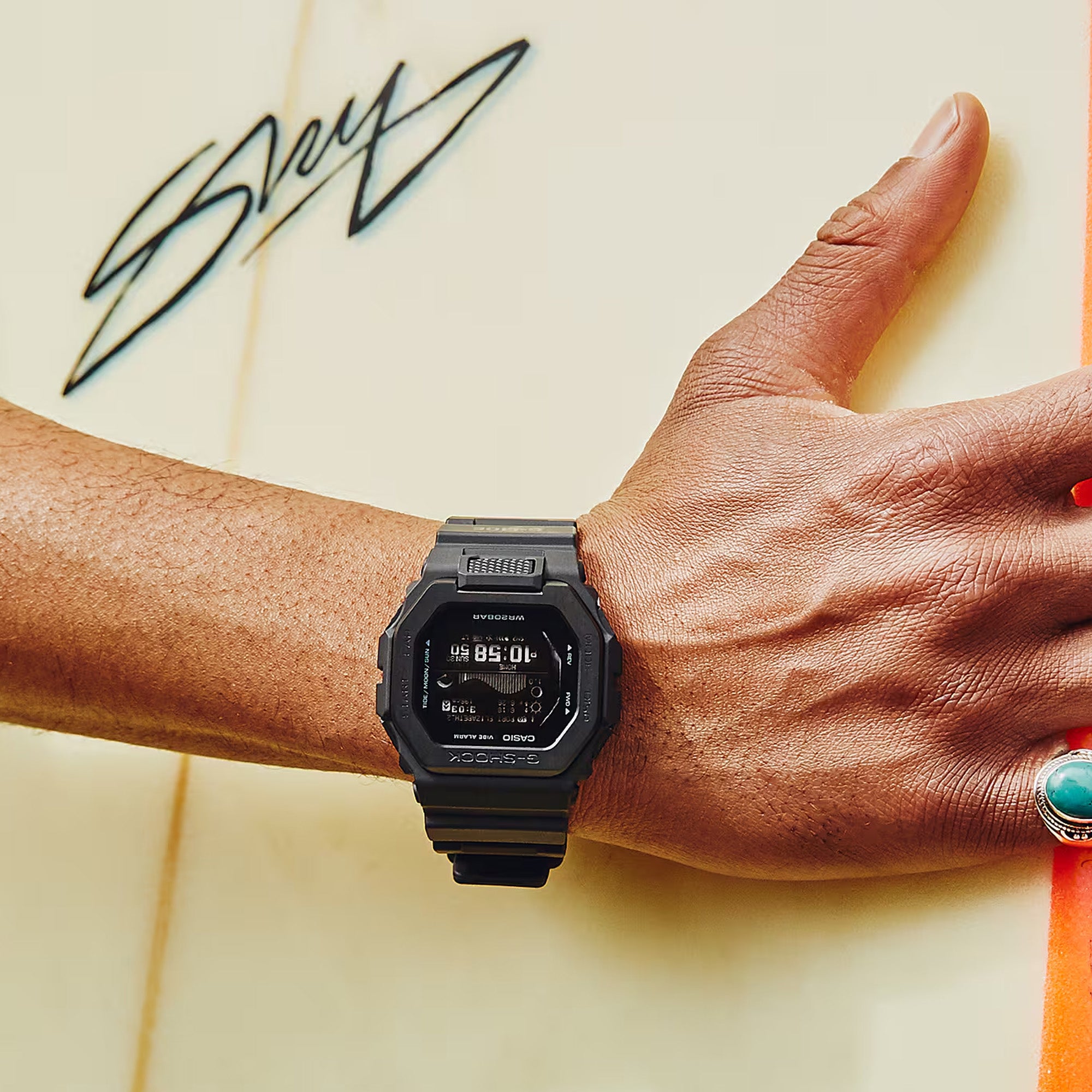 Casio G-LIDE GBX100NS-1D digital surf watch with black resin band, MIP LCD display, Bluetooth connectivity, and tide graph functions - on hand