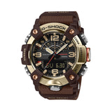 Front-on view of the Casio G-SHOCK Mudmaster Analogue Digital Men's Watch GG-B100XMH-5A, 51mm case, in a carbon fibre-reinforced case with a gold ion-plated stainless steel bezel. The black analogue-digital dial with gold-toned markers is clearly visible from this straight-on angle.