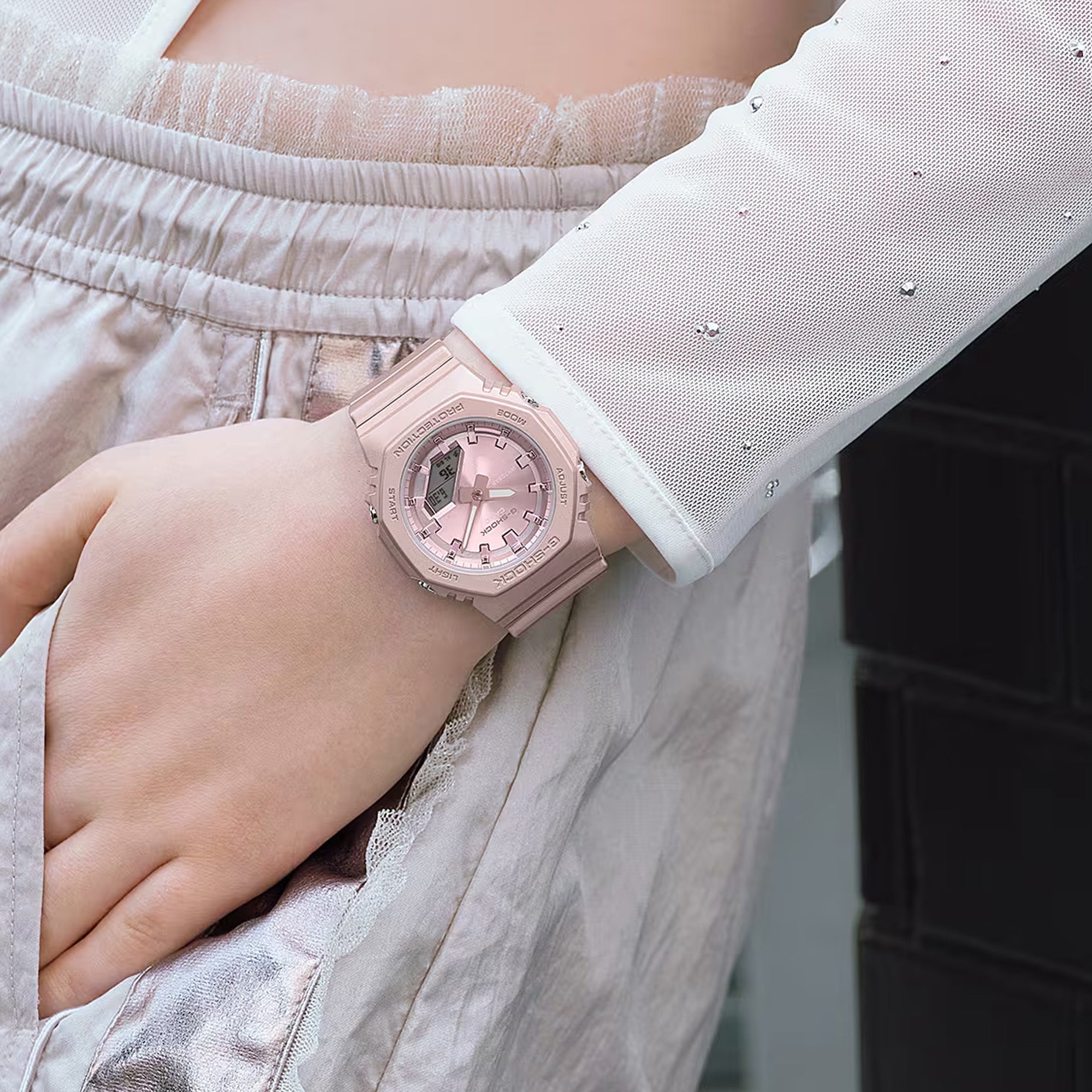 Casio G-Shock GMAP2100ST-4AD front view, featuring the compact 46mm x 40.2mm x 11.2mm octagonal bio-based resin case and band in pearlescent polarised pink with matte finish — shifting softly with the viewing angle — metallic pink vapour deposition dial, minimalist analogue-digital face without inset sub-dial, and hand shift feature.