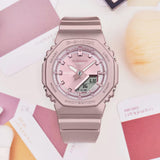 Casio G-Shock GMAP2100ST-4AD front view — pearlescent matte pink octagonal bio-based resin case and band, metallic vapour deposition pink dial, minimalist analogue-digital display. 46mm x 40.2mm x 11.2mm, 40 grams, shock resistant, 200M water resistant.