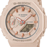 Casio G-Shock GMAS2100-4A front view — blush pink octagonal case, flat minimalist dial with rose gold bar indices, analogue hands, day sub-dial, and digital LCD window. 46.2mm x 11.2mm Carbon Core Guard construction.