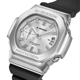 Three-quarter angle view of the Casio G-SHOCK 2500 Series Quartz Men’s Watch GMC2500-1A8, 46.7mm case, highlighting the silver bezel and rounded octagonal case. The silver dial and bar indexes are visible.