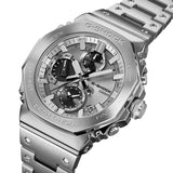 Casio G-Shock GMCB2100ADS-1A front view, featuring the 46.3mm full stainless steel octagonal case with circular hairline bezel and mirror-polished bevelled edges, silvery vapour deposition main dial with contrasting black inset sub-dials, fully analogue three-hand display, and dimpled stainless steel band — crafted at Yamagata Casio.