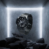 The Casio G-Shock G-Steel Solar Men's Watch GSTB1000BD-1A reveals the carbon fibre dial texture, brick pattern bezel detail, and the deep lustrous finish of the black ion plating in close detail.