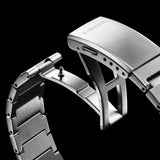 Metallic watch strap with 'G-Shock' branding on a black background