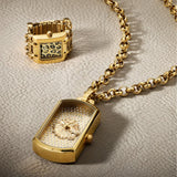 The Guess GW1141G2 is shown face-on, highlighting its 25mm rectangular gold-tone case and glitz-set gold dial. A sculpted GUESS lion’s head sits at the centre of the dial.