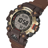 Three-quarter angle view of the Casio G-SHOCK Solar Men's Watch GW-9500MH-5, 53mm case, highlighting the mud-resistant guarded buttons and gold ion-plated bezel detailing. The duplex LCD display is visible from this angle.