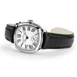 Hamilton American Classic Cushion Mechanical Women’s 30mm Watch H36109710 is shown from the side, displaying the slim cushion-shaped steel case and crown. The black leather strap extends from the lugs beneath the sapphire crystal.