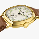Hamilton American Classic Cushion Mechanical Unisex 34mm Watch H36139520 is shown from the side, displaying the slim yellow gold PVD case and crown. The brown leather strap extends from the lugs beneath the sapphire crystal.