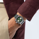 Hamilton American Classic Intra-Matic Chronograph H38429861 worn on wrist with casual denim jacket, showcasing hunter green dial