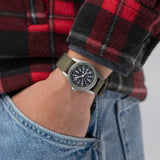 On Wrist: Hamilton Khaki Field Mechanical 36mm Watch H69399930 sits on a khaki cotton NATO strap secured with a pin buckle. Its compact 36mm matte stainless steel case offers a true-to-original military field watch profile.