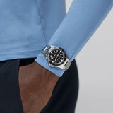 Hamilton Khaki Navy Scuba Auto 40mm Watch H82415130 is paired with a stainless steel bracelet secured by a folding clasp. Its 40mm case offers a versatile fit suited to both diving and everyday wear.