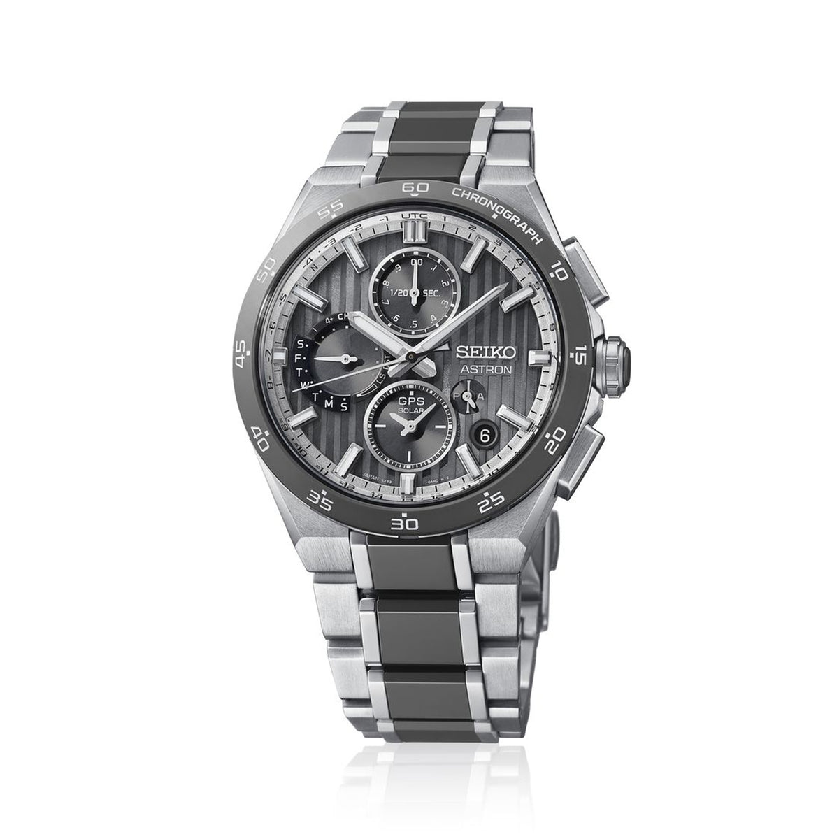 The Seiko Astron GPS Solar 43.20mm Men's Watch HAB007J features a grey striped dial with LumiBrite hands and index, set within a titanium case with a grey ceramic bezel and silver-toned metallic accents.