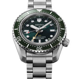 From this angle, the green ceramic bezel, textured dial and gold-tone GMT hand are visible together against the mirror-finished case profile.