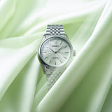 The Seiko Presage Automatic 38mm Watch HCC002J reveals the dial's fine textured pattern and green colouring in close detail.