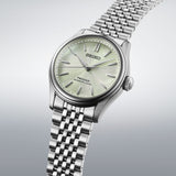 From this angle, the Seiko Presage Automatic 38mm Watch HCC002J shows the green dial's textured depth together with the polished stainless steel case and bracelet.