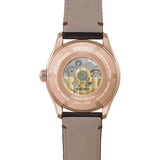 The Seiko Presage Automatic 38mm Watch HCC008J is fitted with a dark brown leather strap. The screw-down, see-through case back reveals the automatic Calibre 6R51 movement and an individually engraved serial number.