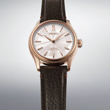 The Seiko Presage Automatic 38mm Watch HCC008J reveals the dial's pearl-painted texture and dramatic wave pattern in close detail.
