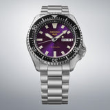 From this angle, the Seiko 5 Sports SKX Series Automatic Men's 42.50mm Watch HDB003K shows the Edo purple dial's gold logo and rotating bezel together with the stainless steel bracelet.