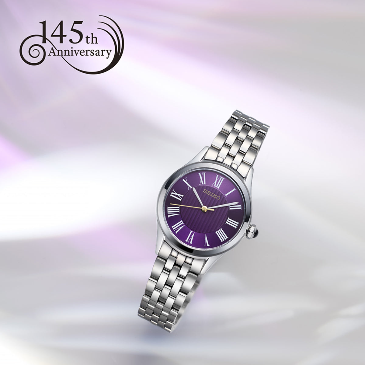 From this angle, the Seiko Conceptual Quartz Women’s 29.60mm Watch HGH004P shows the purple dial’s depth and Roman numerals together with the polished stainless steel case and bracelet.