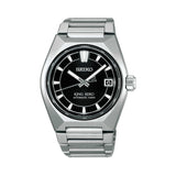 The King Seiko VANAC Automatic 41mm Men's Watch HKF003J features a black dial with a three-dimensional horizontal pattern, LumiBrite hands and indexes, and a date window. The 41mm bezel-less titanium case is fitted with a box-shaped sapphire crystal.