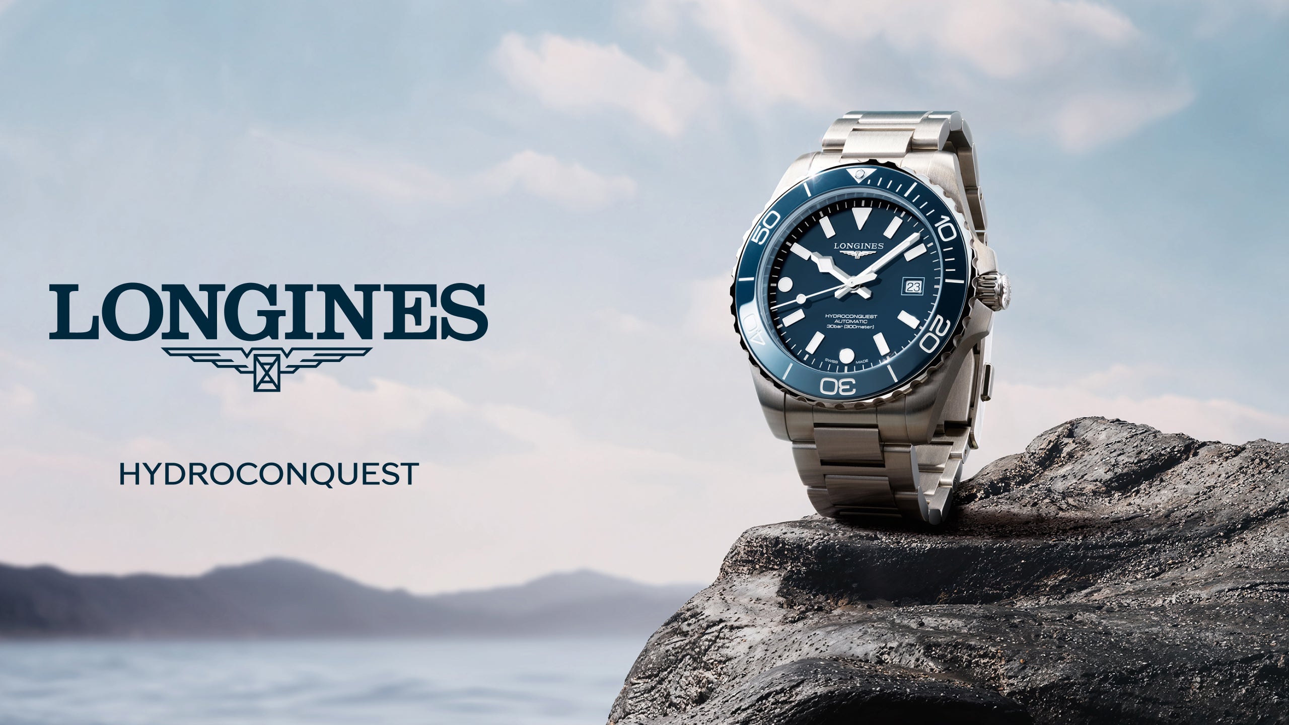Longines HydroConquest watch on a rock with a scenic background