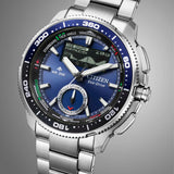 Citizen Promaster Analogue Digital 42mm Men's Watch JV3006-50L - This angle captures the blue dial, digital display, and rotating bezel together in one view. The stainless steel case and bracelet remain clearly visible from this perspective.