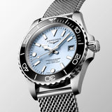 Angled front view of the Longines HydroConquest Automatic 39mm L3.779.4.99.6, highlighting the unidirectional rotating bezel with black ceramic insert and the mesh bracelet. The 39mm stainless steel case strikes a balance between sport performance and everyday elegance.