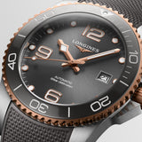 The Longines Hydro Conquest Automatic Men’s 41mm Watch L3.781.3.78.9 reveals the sunray finish of its grey dial, applied numerals and rose gold-tone hands in close detail.