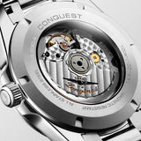 Back view of the Longines Conquest Men’s 41mm Automatic Watch L3.830.4.52.6, showing its sapphire crystal case back. The window shows the automatic movement with silicon balance spring, which gives the watch up to 72 hours of power reserve.