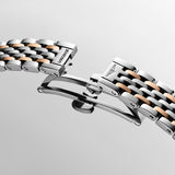 Close-up of the Longines Elegant L4.309.5.80.7 triple safety folding clasp with push-piece opening mechanism. Finished in matching rose gold and stainless steel, the clasp ensures a secure and comfortable fit while maintaining the bracelet's elegant aesthetic.