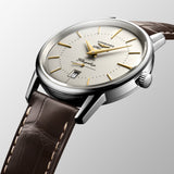 Three-quarter angle view of the Longines Heritage Flagship Automatic Men’s 38.5mm Watch L4.795.4.78.2, showing the case profile and crown. The angle highlights the polished stainless steel case and the slim, elegant lines of this vintage-inspired dress watch.
