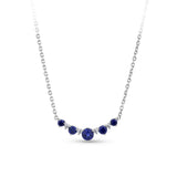 Front-on view of the Wallace Bishop 0.04 TDW Created Sapphire & Lab-Grown Diamond Chevron Pendant in Sterling Silver, reference LG34SAP03, on a cable chain with a parrot clasp. The pendant features a chevron-style row of claw-set round created dark blue sapphires with small round lab-grown diamonds between them, with the largest sapphire at the centre.