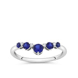 Front-on view of the Wallace Bishop 0.04 TDW Created Sapphire & Lab-Grown Diamond Chevron Ring in Sterling Silver, reference LG38SAP02O, on a smooth polished band. The ring features five round created dark blue sapphires in a curved chevron V shape, with four claw-set round lab-grown diamonds set between them.