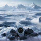 Luminox Navy SEAL Men's 45mm Quartz Watch XS.3507.WB shown in a rugged outdoor setting. This Navy SEAL 3500 Series Arctic Edition dive watch features a black dial, a white fibreglass case and 200m water resistance.