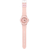 Casio Baby-G+PLUS BGA15K-4A close-up of the pastel pink matte silicone strap with detachable centre case mechanism, alongside the included round silicone holder that converts the watch into a bag charm or keyring accessory.