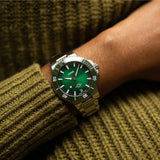 Oris Aquis Date Calibre 400 43.5mm green dial watch worn on wrist, showcasing size and sporty diver design