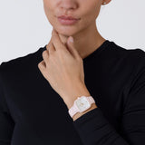 Rado True Square Diamonds 29.2mm R27181902 worn on wrist – white mother of pearl dial with diamond markers, pink high-tech ceramic case and bracelet, petite women’s square quartz watch shown on wrist